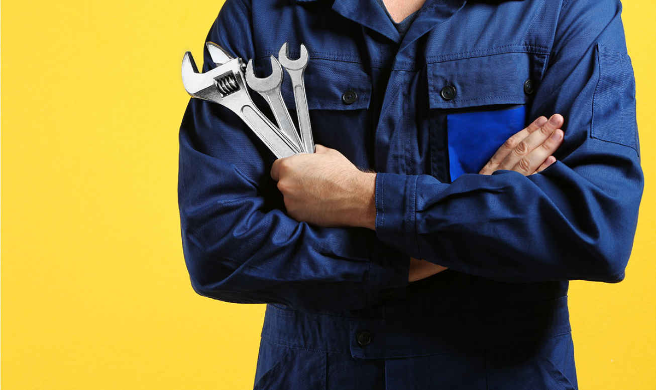 service – air conditioning technician holding tools – yellow background service - air conditioning technician holding tools - yellow background